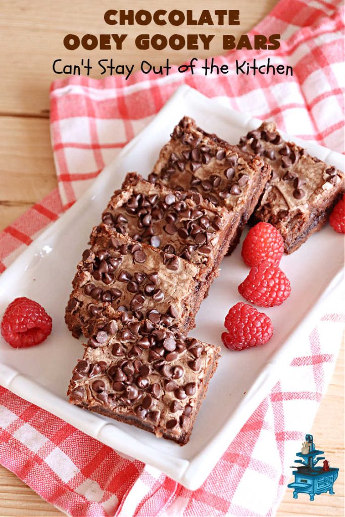 Chocolate Ooey Gooey Bars | Can't Stay Out of the Kitchen | You'll be raving over every drool-worthy bite of these fantastic #OoeyGooeyBars. They're made with 3 kinds of #chocolate & just ooze deliciousness in every bite. The #Cheesecake layer alone will leave you swooning! #cookie #brownie #tailgating #dessert, #CreamCheese #ChocolateChips #ChocolateDessert #HolidayDessert #OoeyGooeyDessert #ChocolateOoeyGooeyBars