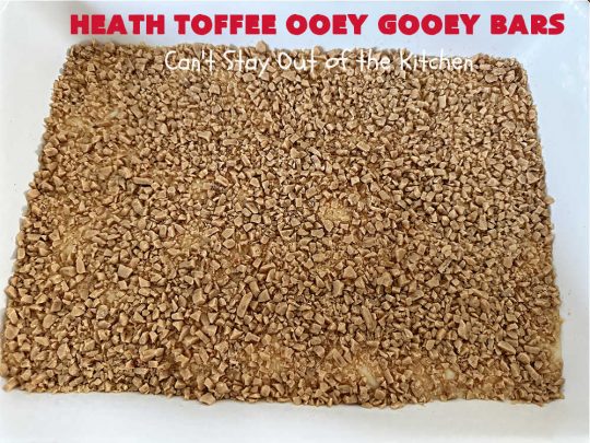 Heath Toffee Ooey Gooey Bars | Can't Stay Out of the Kitchen | These #OoeyGooeyBars are outrageously good! If you want an earth-shattering experience, bake up a batch of these lovely #brownies for your next #tailgating party, potluck or backyard BBQ. This easy #recipe uses only 6 ingredients! #cookies #dessert #HeathEnglishToffeeBits #HeathToffee #HeathToffeeOoeyGooeyBars